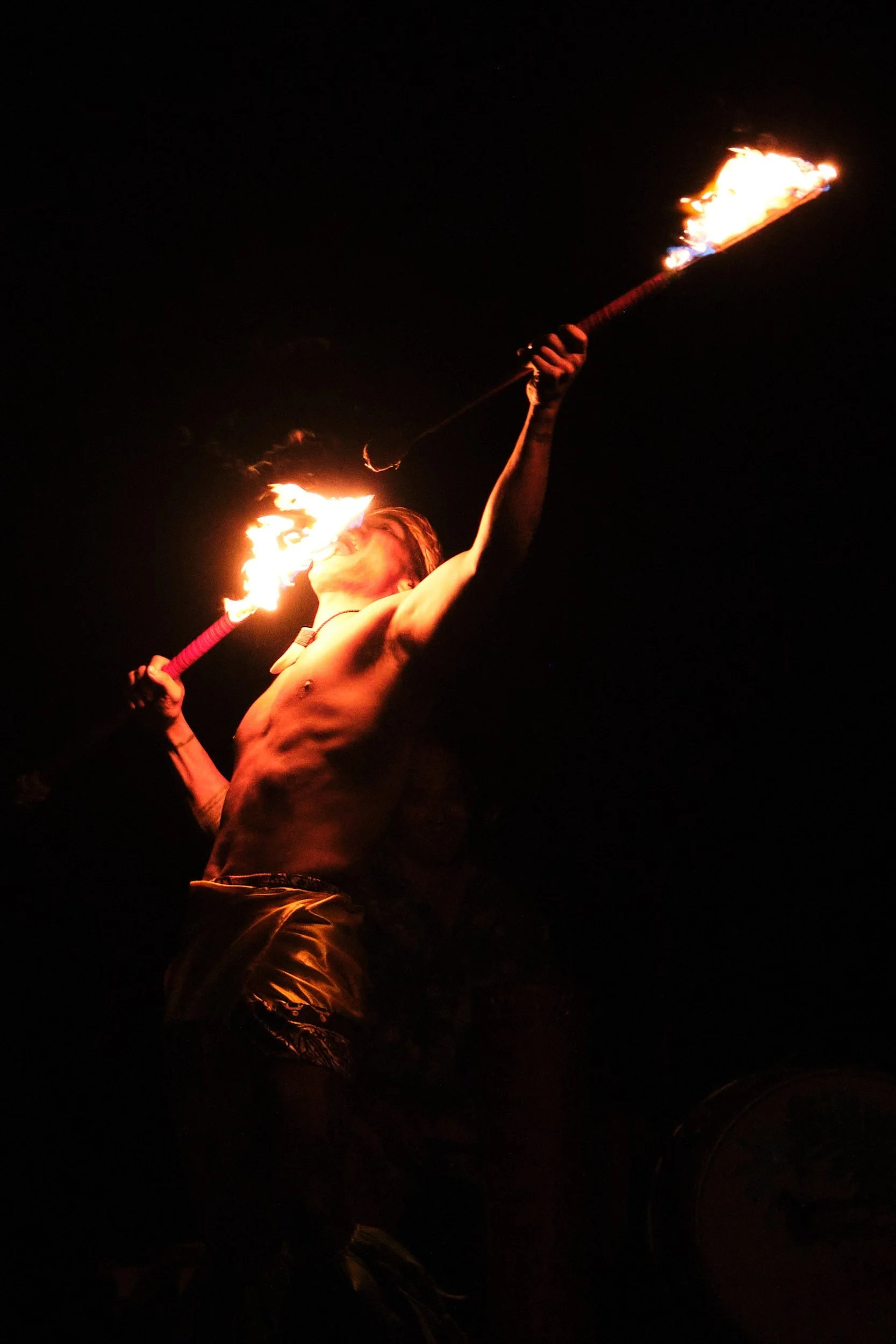 Fire dancer performing at the Andaz luau, Orange County