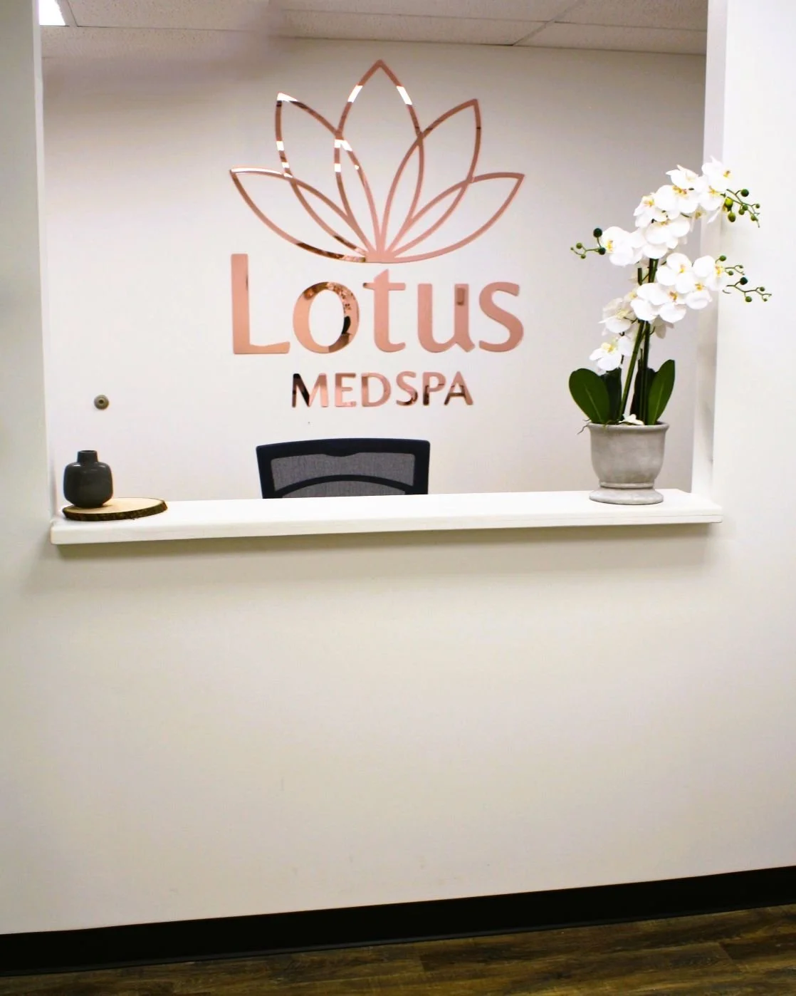 Clean, professional medical spa treatment room with neutral tones at Lotus Med Spa in Jackson