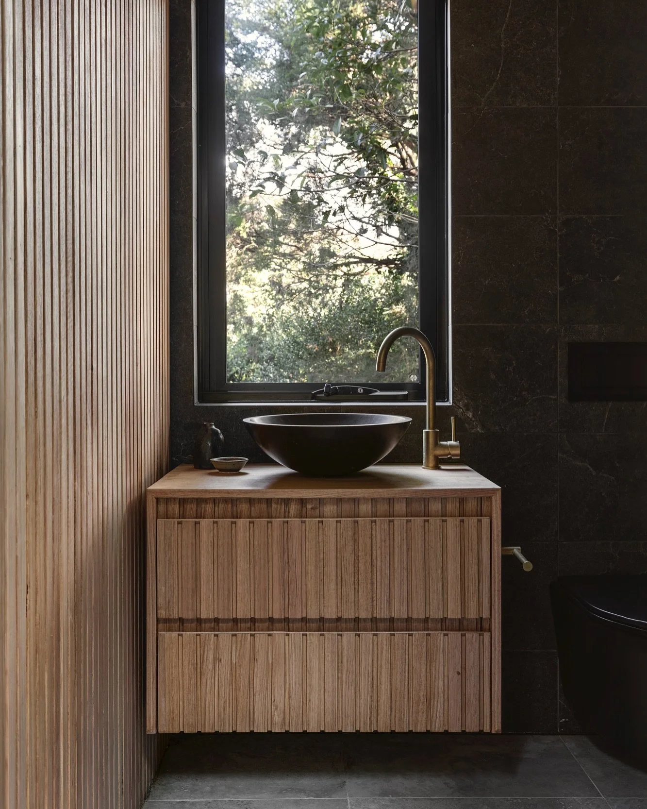 A silent feeling bathroom with an Aussie bushland view. So impressed with this custom built @porta_timber vanity and wall by the clever-ist: @onwardbuildingco. Nailing the owners&rsquo; brief to bring the outside in, Japanese style, finished off beau