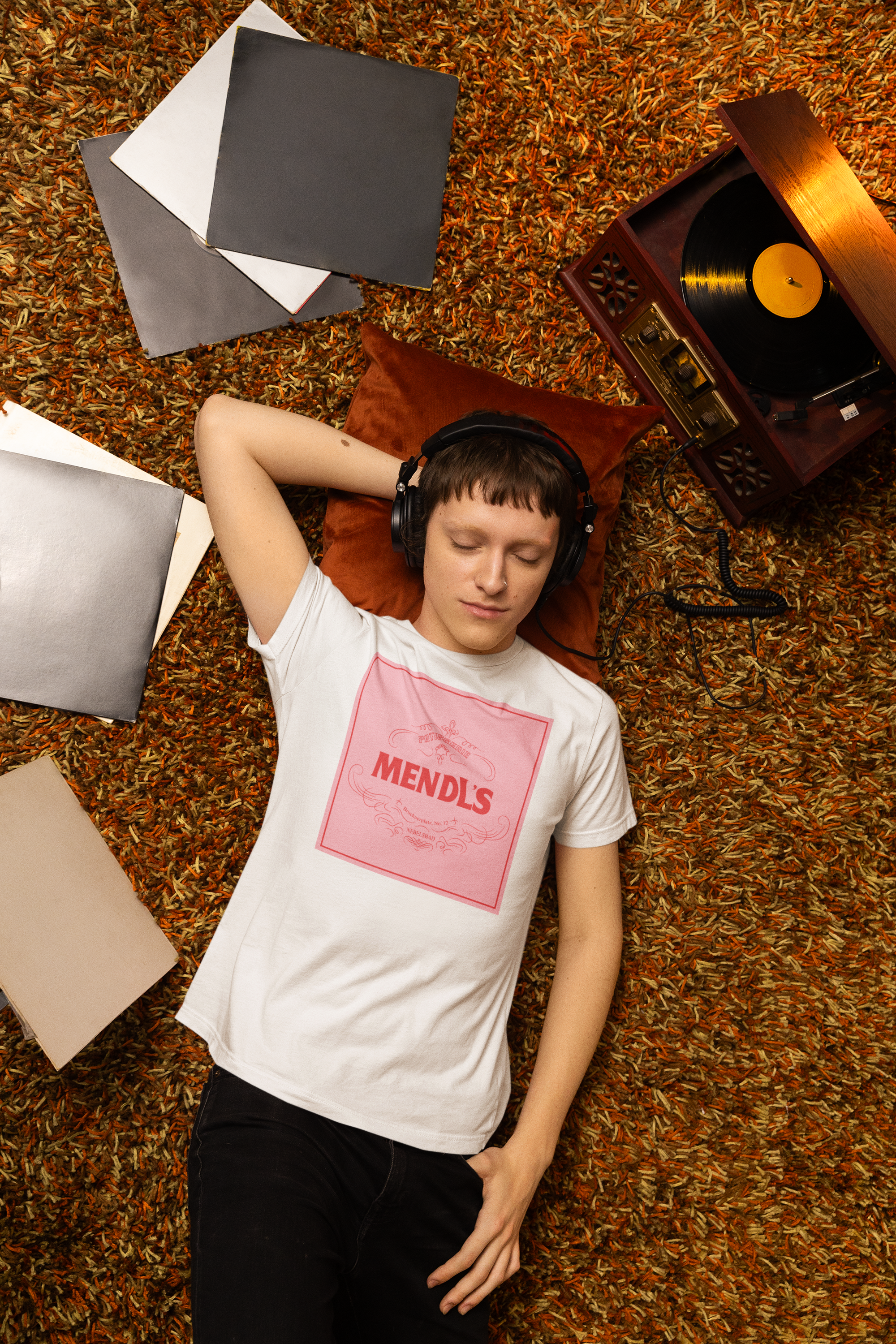 bella-canvas-t-shirt-mockup-of-a-man-listening-to-music-surrounded-by-vinyl-records-m37044(2).png