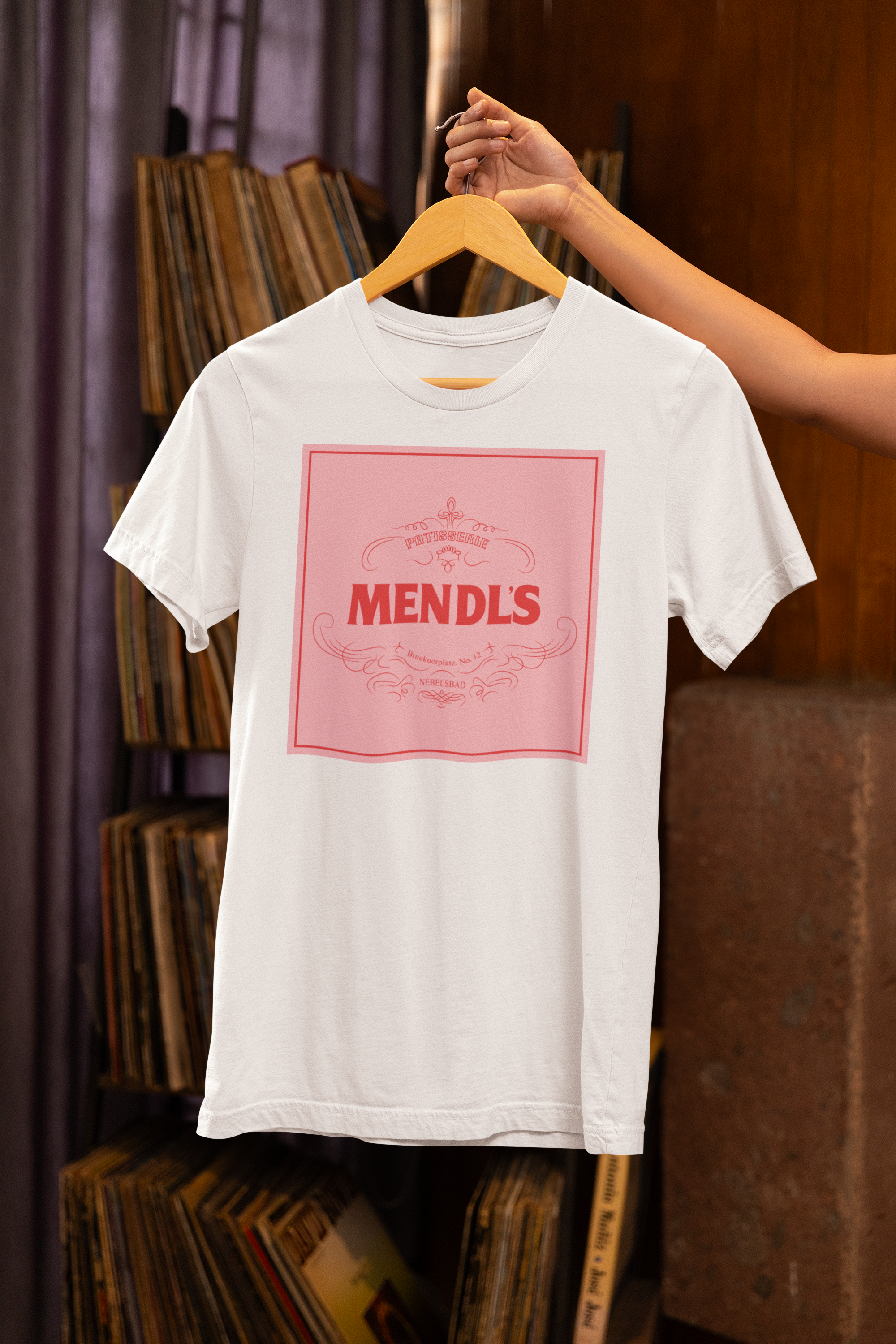 bella-canvas-t-shirt-mockup-featuring-a-person-on-a-vinyl-shop-m37041(1).png