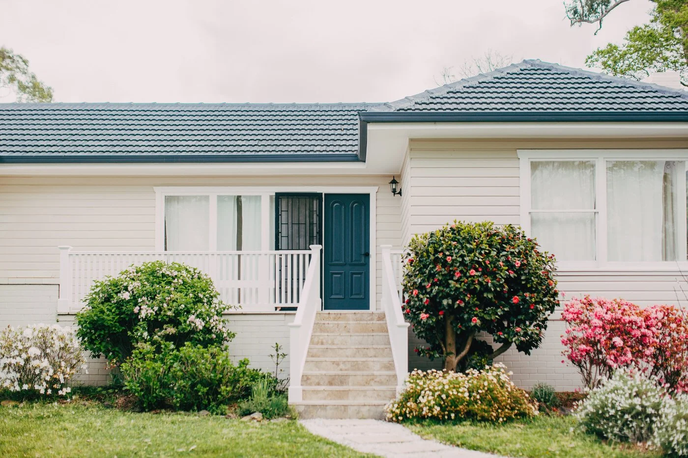 Elegant suburban home exterior showcasing potential for custom extensions in Hills District, featuring traditional architecture with landscaped front garden and classic entryway