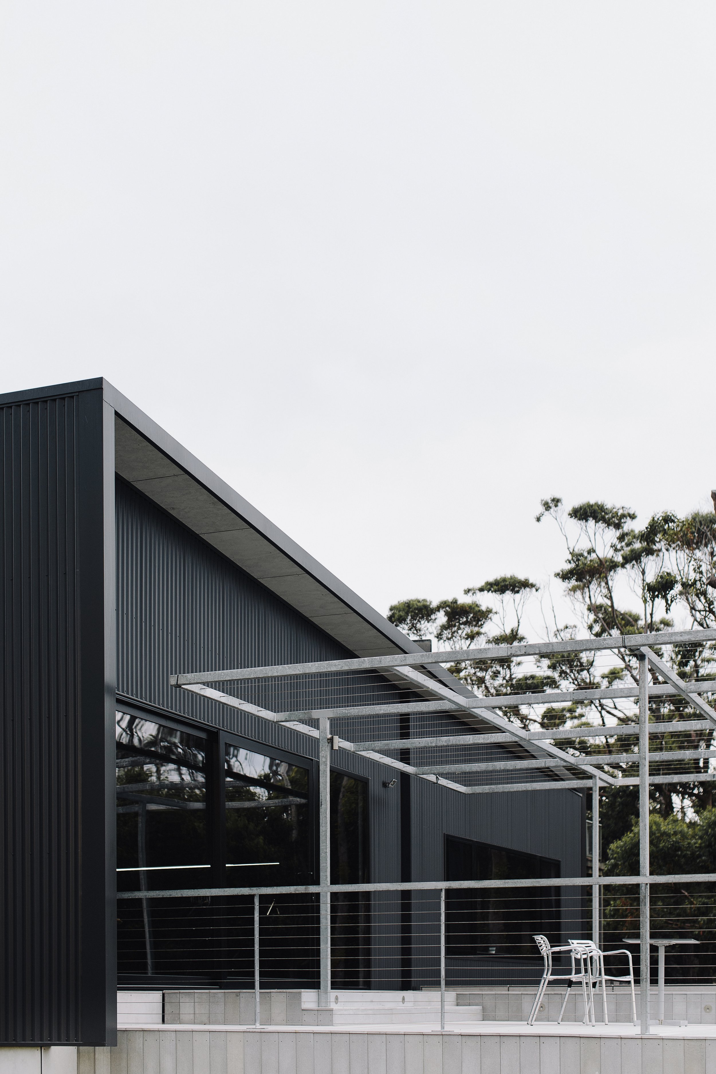 Multi-storey contemporary structure with private outdoor terrace and expansive glazing, showcasing the space maximisation achieved in granny flats in Cremorne Point