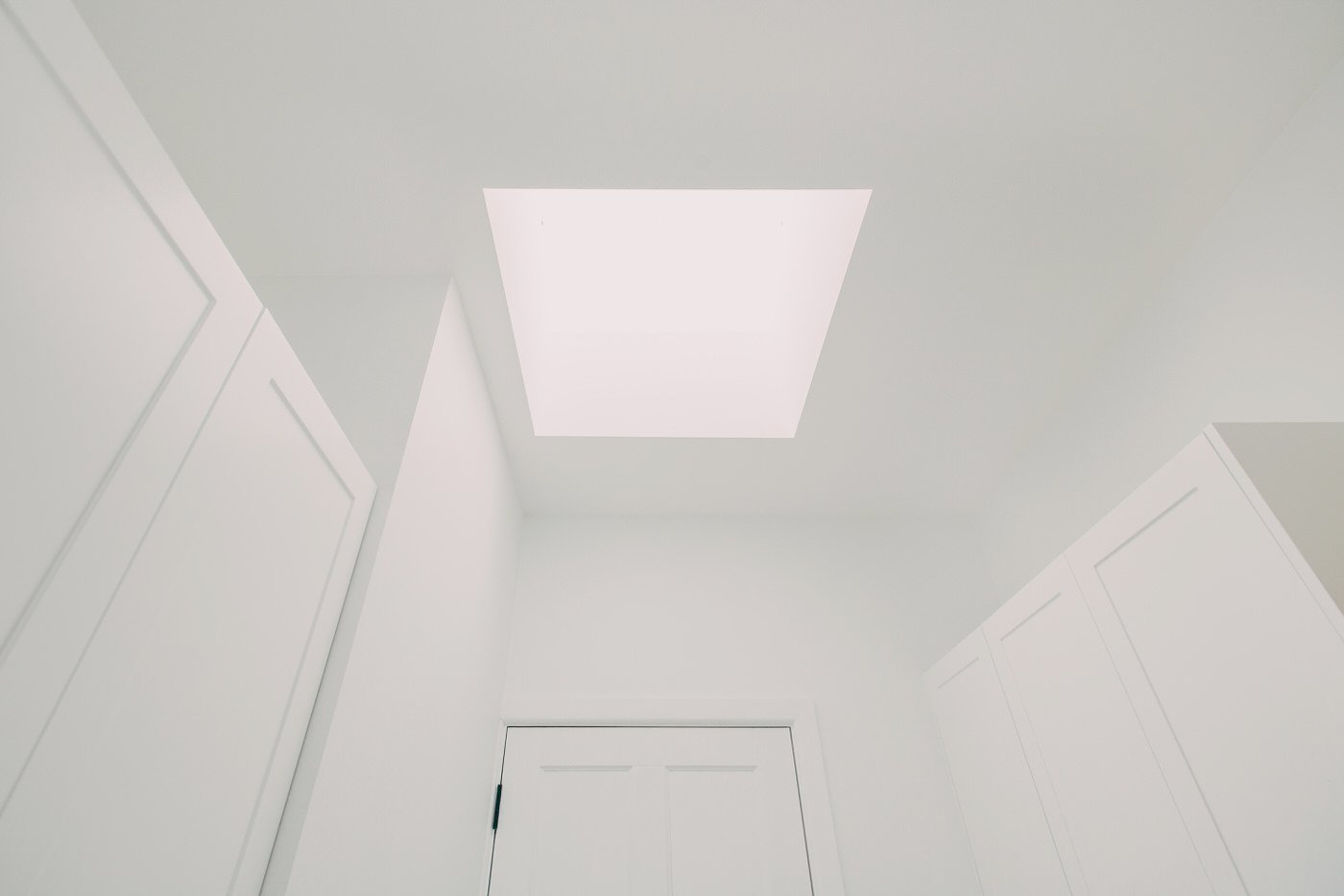 Recessed ceiling light with white cabinetry in a custom extension interior renovation in Kellyville