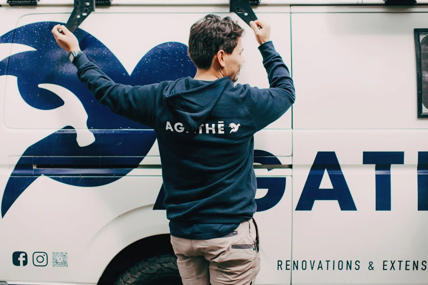 AGATHĒ builder preparing tools and equipment from branded work vehicle for granny flats in North Shore renovation and extension projects