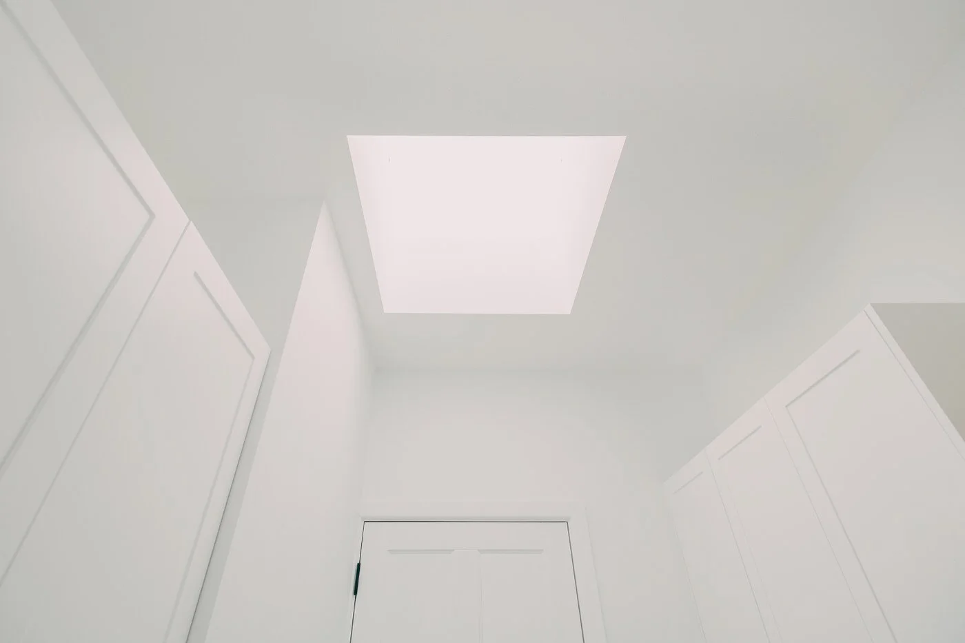 Large square skylight installation bringing natural light into a custom extension interior renovation in Dural