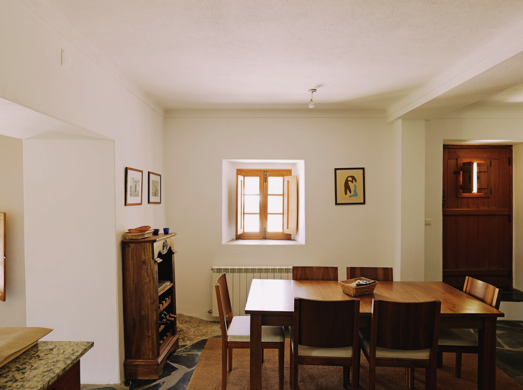 kitchen with window facing terrace and swimming pool