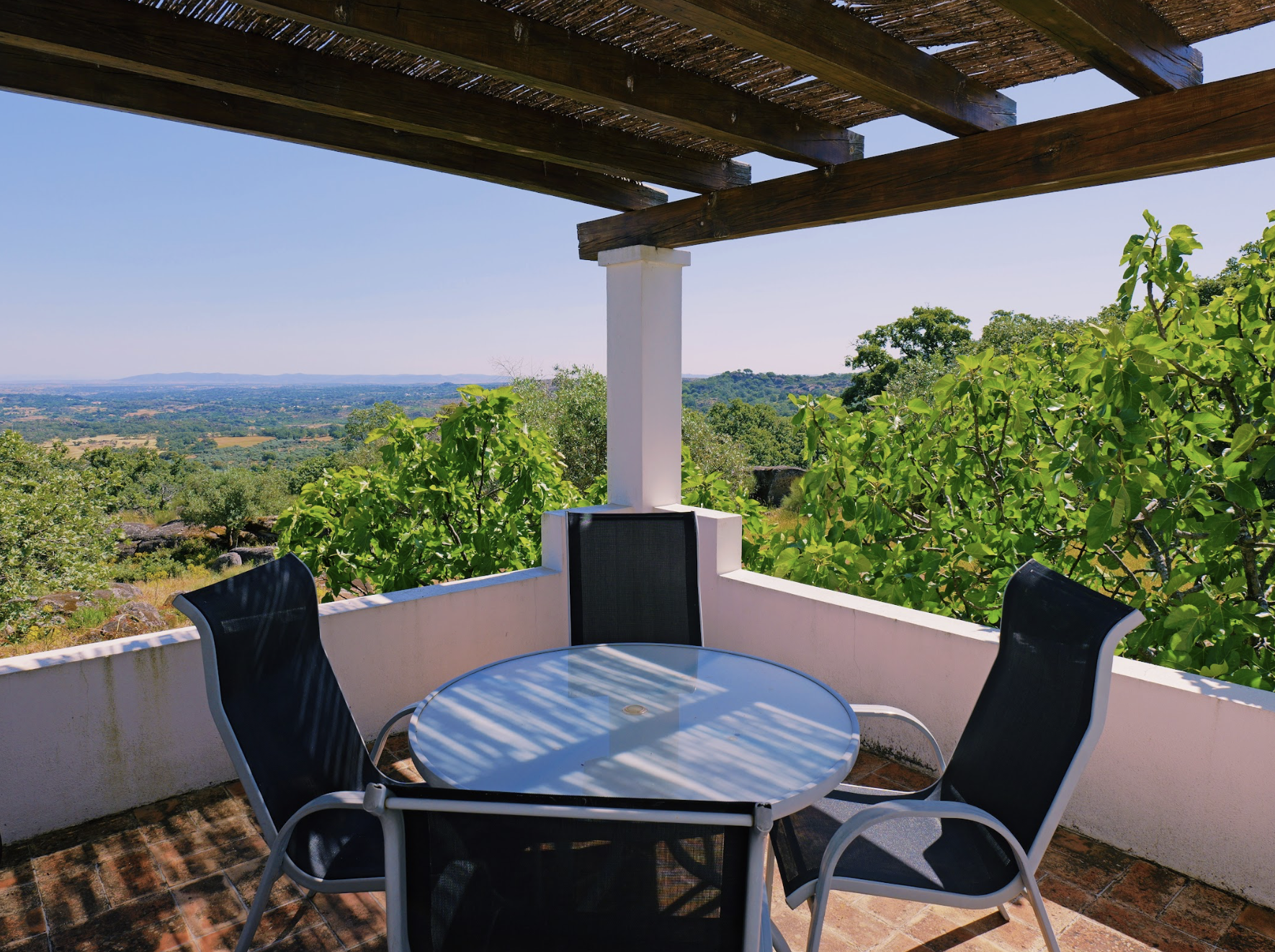 Outdoor dining area with view over the valley looking towards Spain