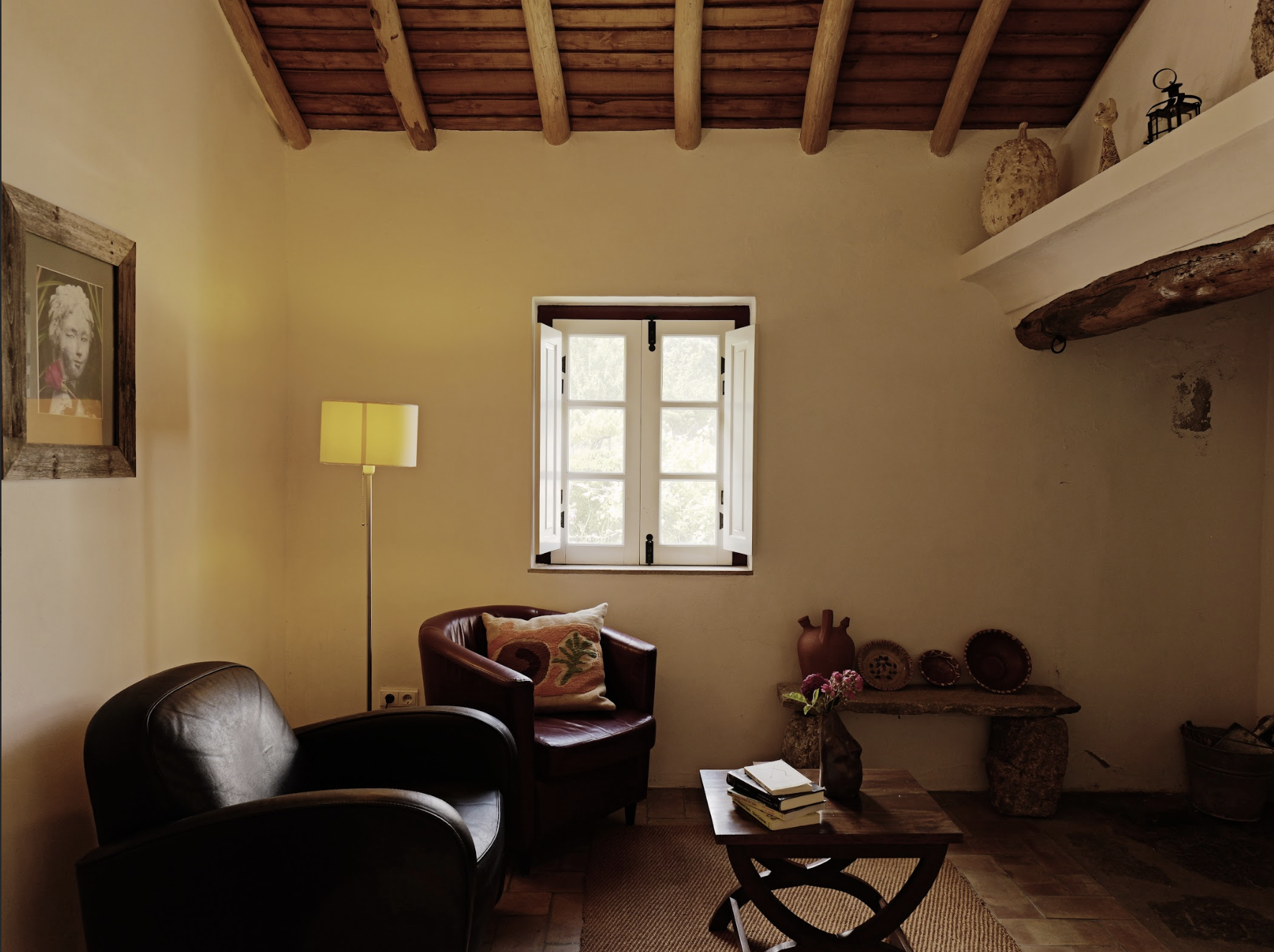 Living room space with traditional fire place and wood burner