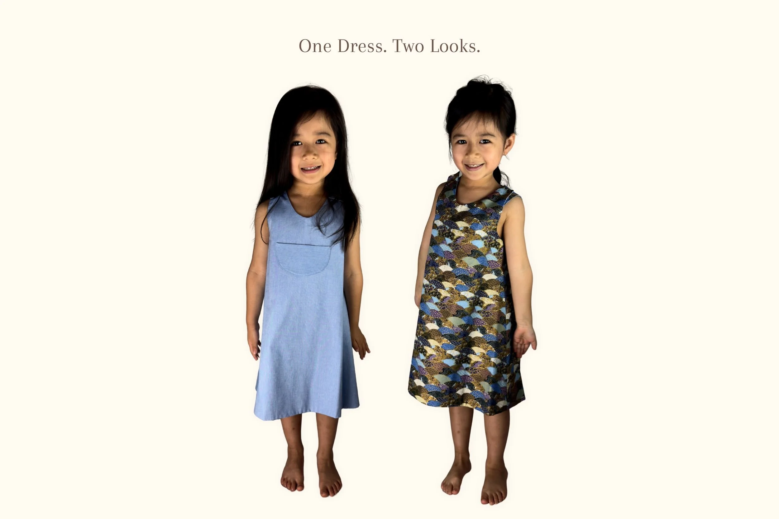 Two girls model the blue and Seigaiha-print sides of the same reversible Penefold dress.