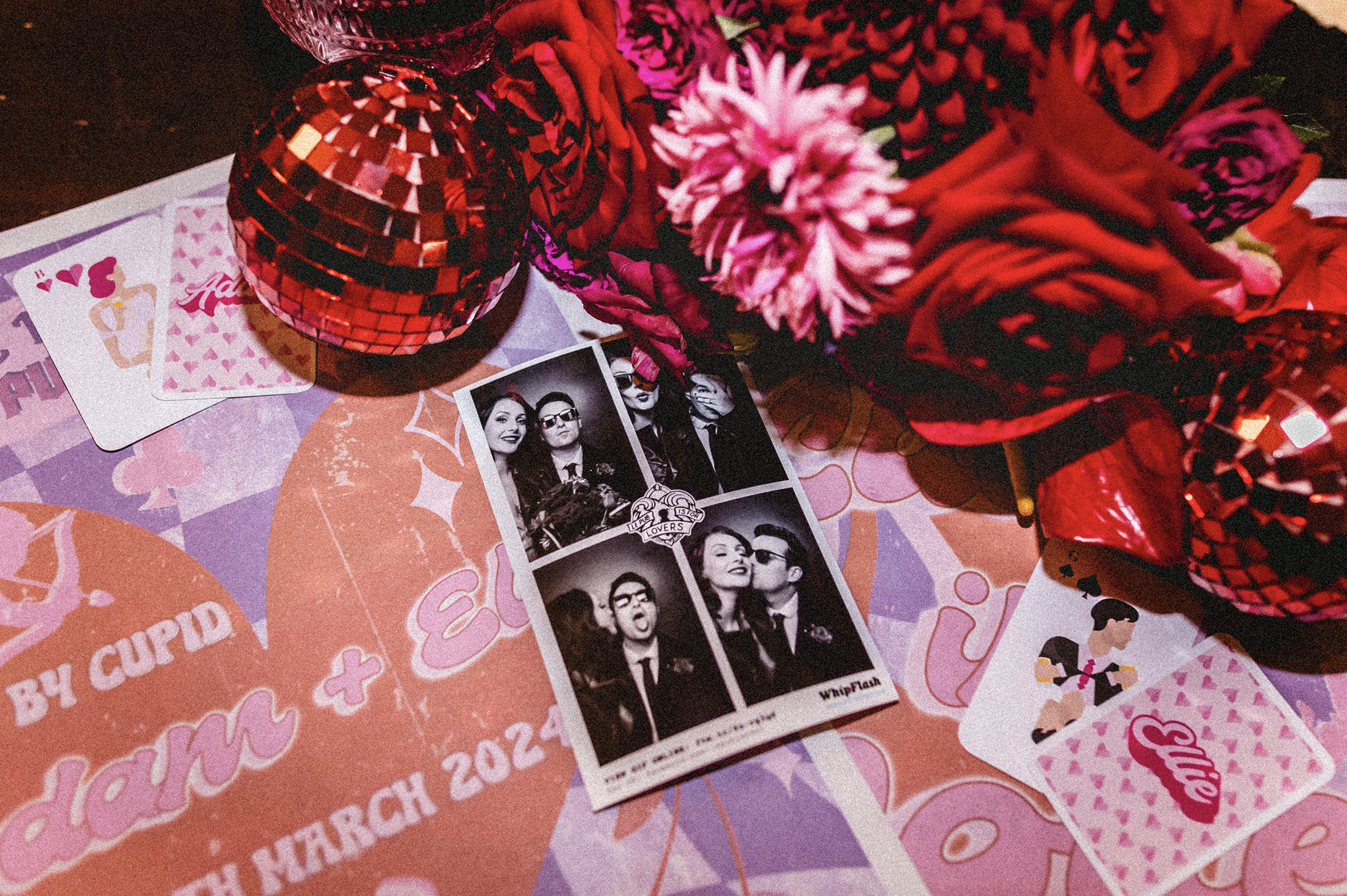colourful wedding details including a photobooth photo of a married couple and discoballs