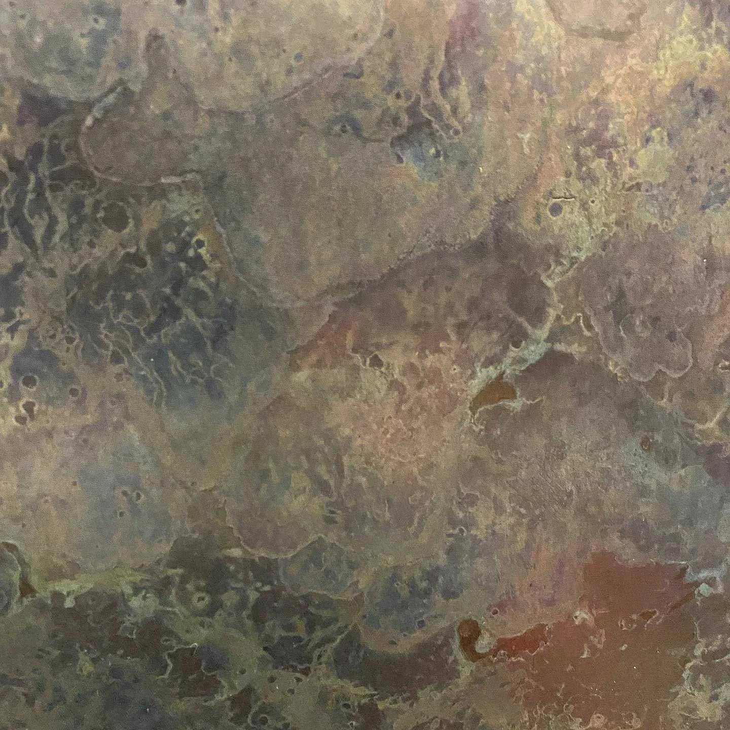 Abstract patina texture in grey opalescent tones on a metal surface