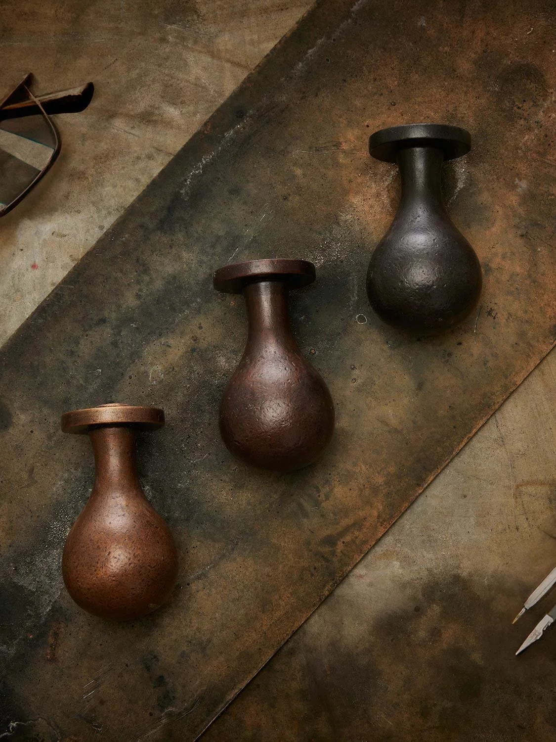 Three Ize Ltd door knobs in different bronze patinas