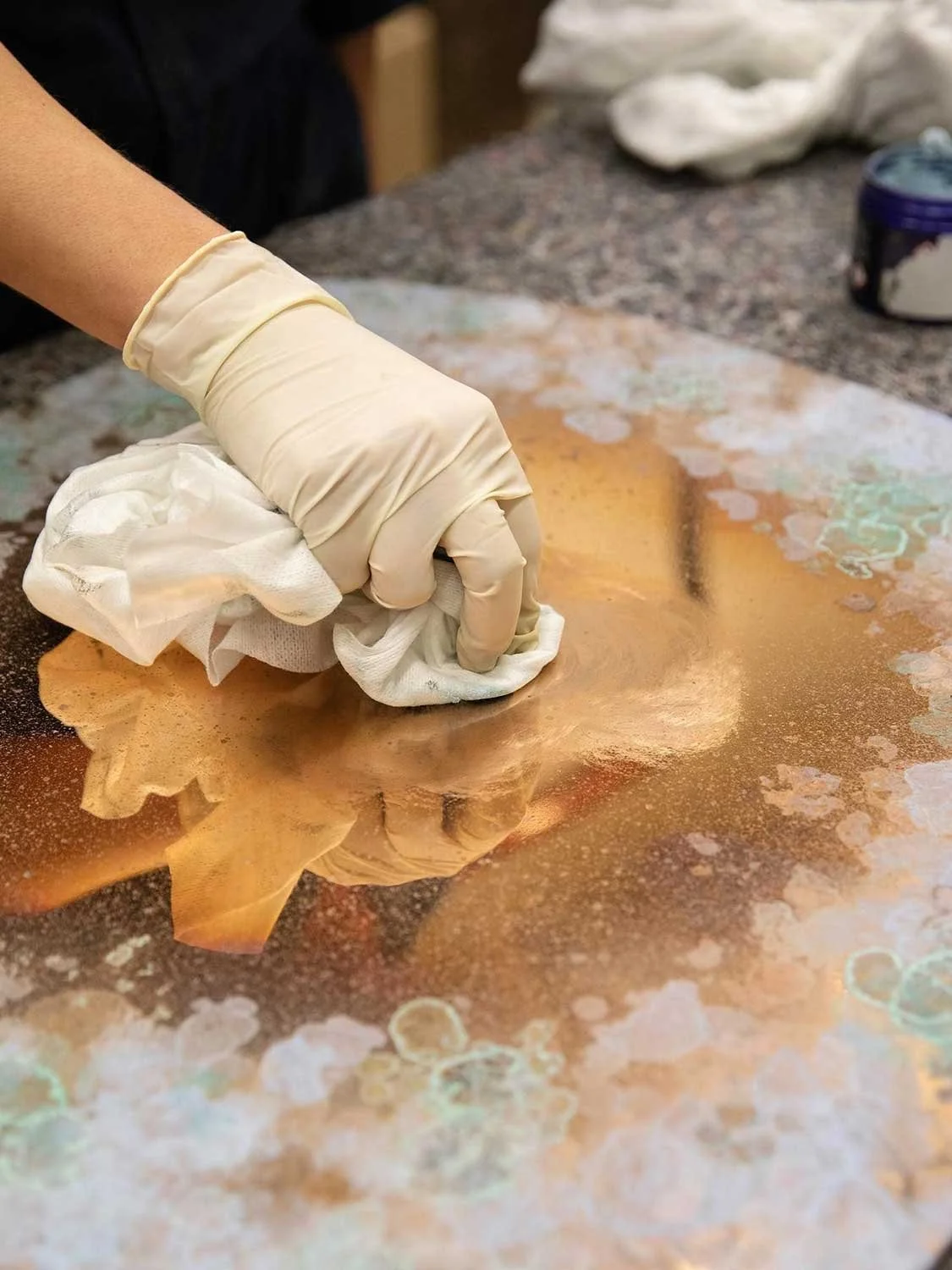 Close up of Charlotte Kingsnorth Lichen Mirror being patinated