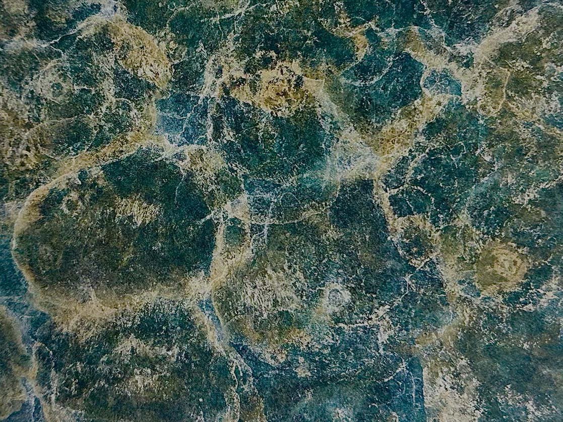Abstract forest green, teal and yellow marble effect patina on a metal surface used in a background slideshow