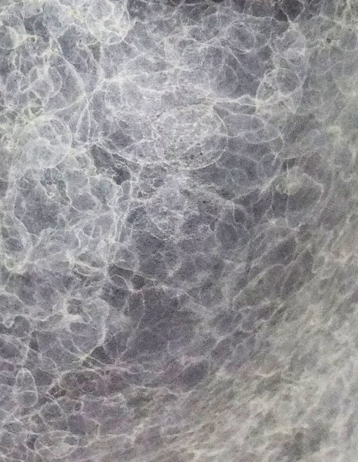 Abstract patina texture in silver and grey tones on metal surface