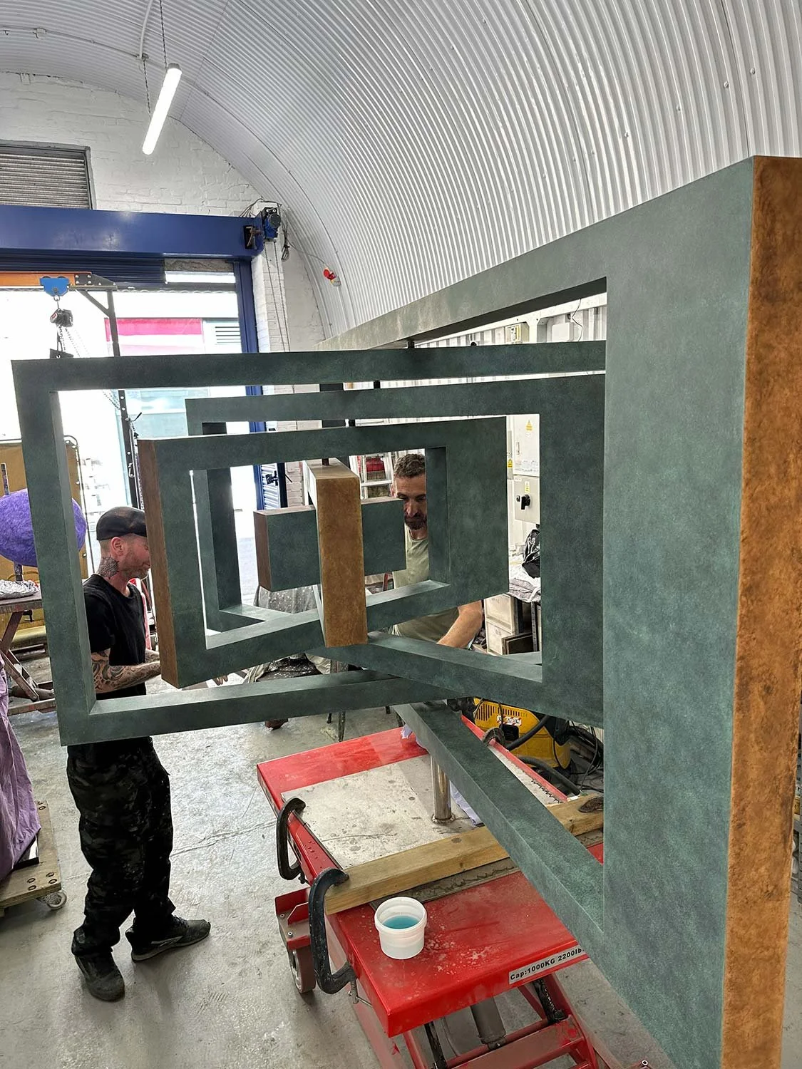 Process shot of Ivan Black sculpture being patinated