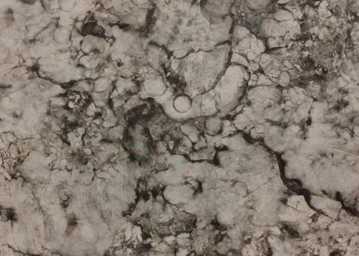 Abstract pale greys and black marble like patina on a metal surface used in a background slideshow