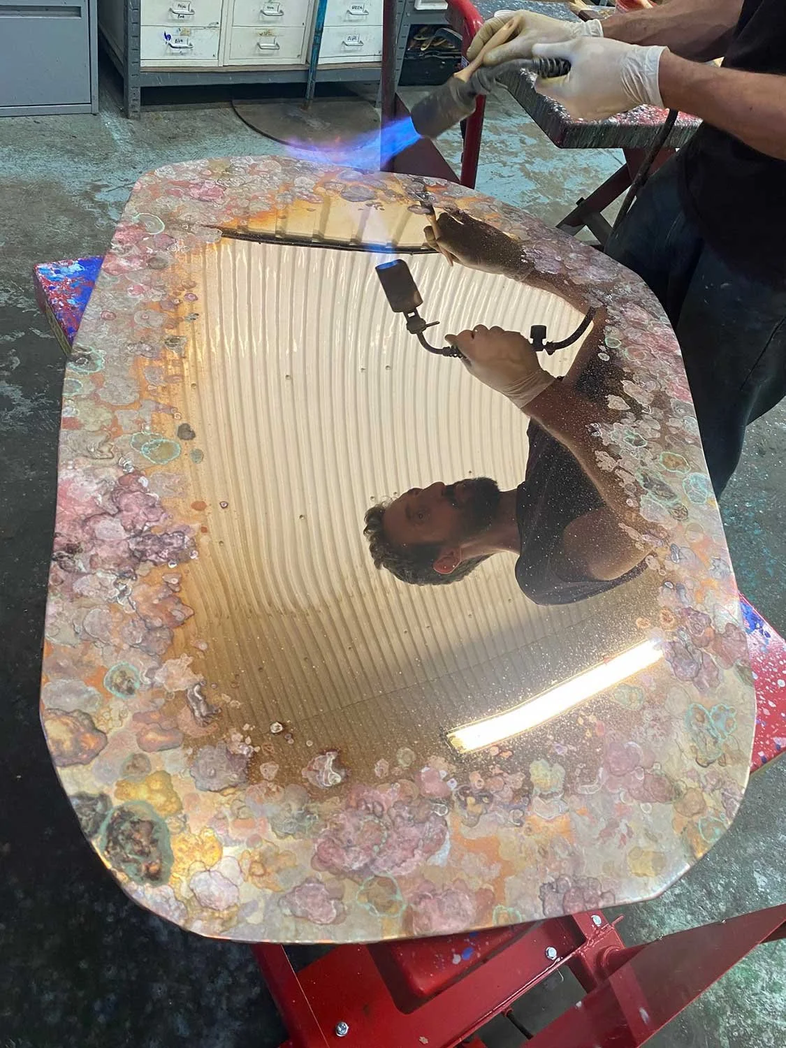 Process photo of Charlotte Kingsnorth - Black Lichen Mirror being patinated