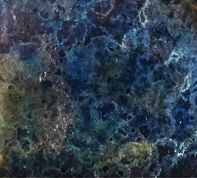 Abstract patina texture in navy and purple tones on a metal surface