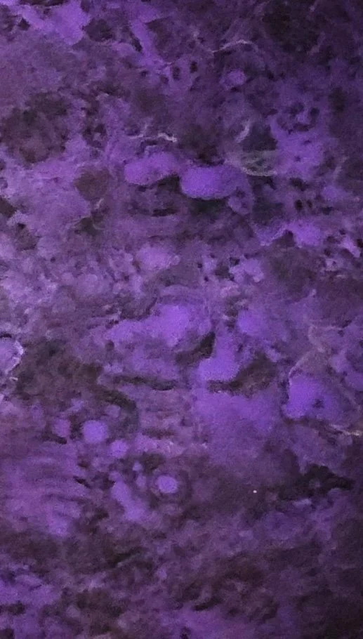 Abstract patina texture in purple tones on metal surface