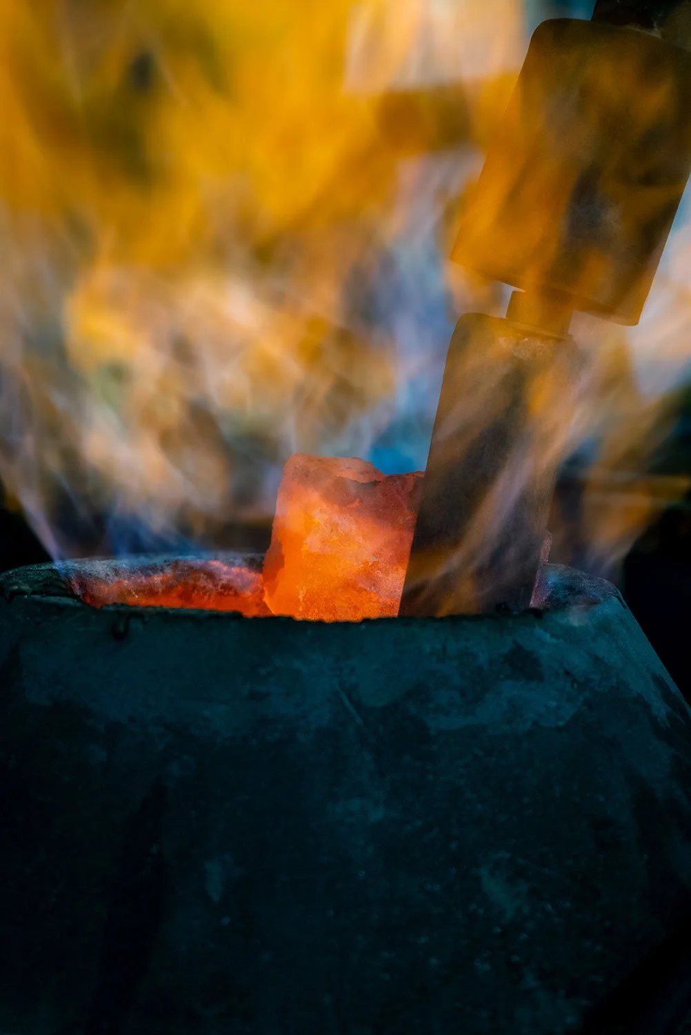 Abstract detail of hot metal and flames during casting process