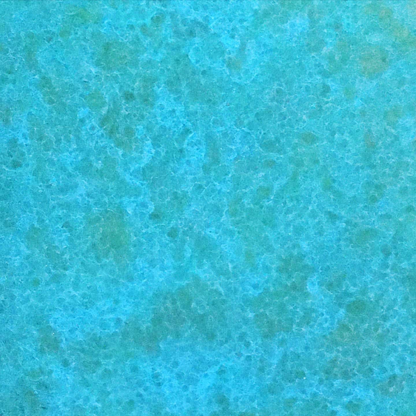 Abstract patina texture with bright turquoise tones on a metal surface