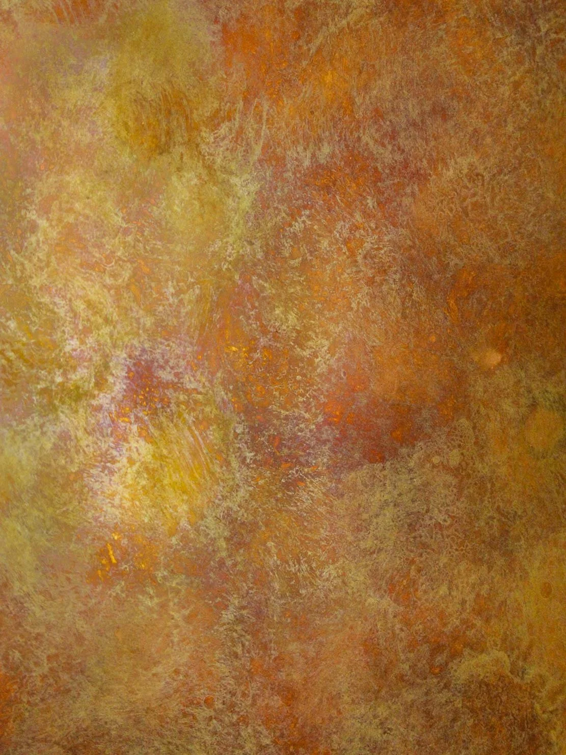 Detail of a Abstract patina texture with layered ochre, yellow and rust tones on metal surface