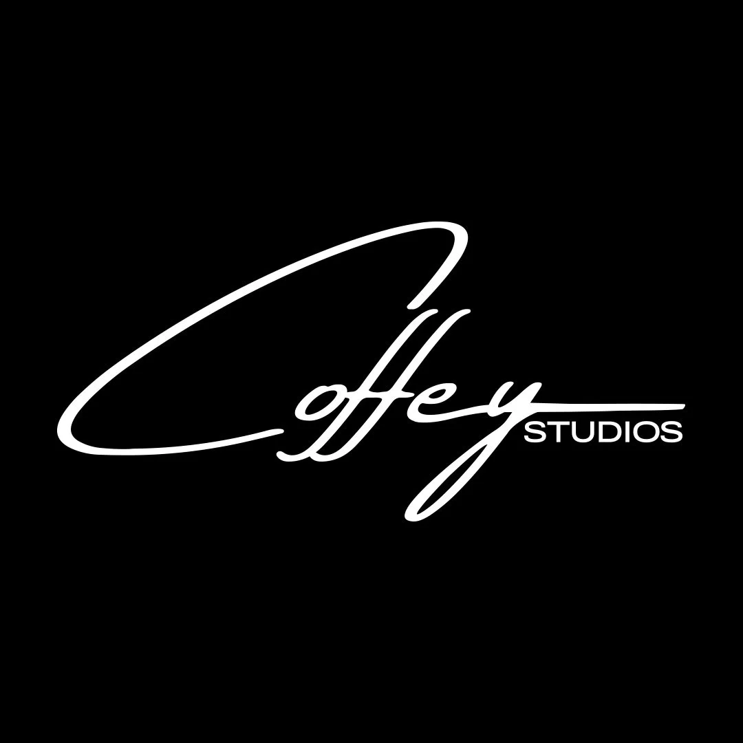 Black background with white cursive text reading 'Coffy Studios' and a stylized underline.