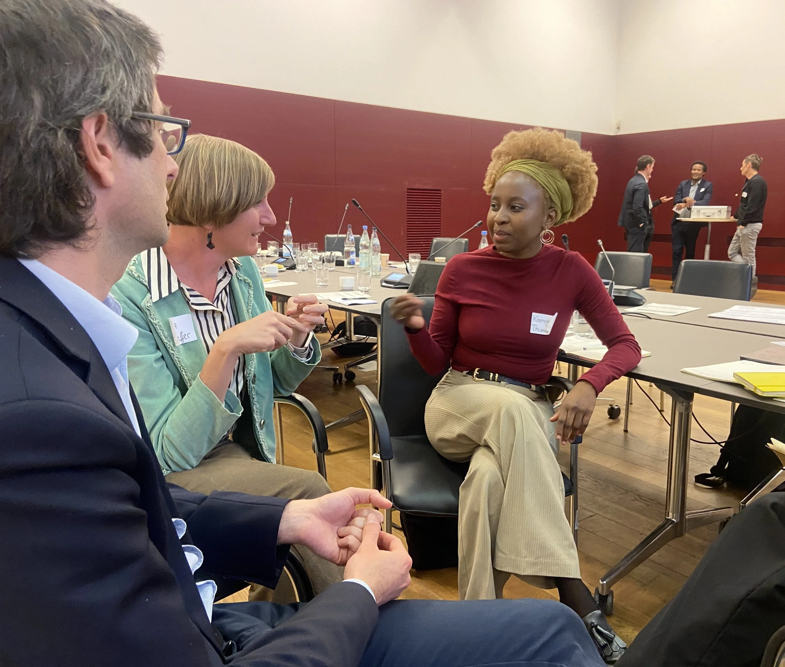 Tsarona founder Kamogelo Thumankwe speaking with attendees at a food innovation business event in Germany