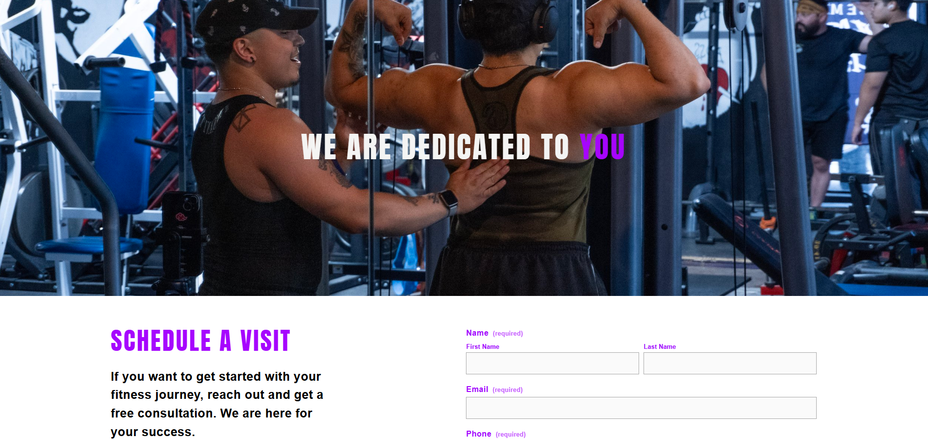Two women fitness trainers in a gym, one coaching the other on bodybuilding, with text overlay stating "We are dedicated to you" and a scheduling form below.