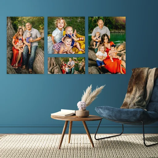 Set of five framed family photos on blue wall, showing various moments with children and adults outdoors by trees and water. A cozy living room with a wooden side table holding a book and decorative vase with pampas grass, and a modern armchair with a blanket draped over it.