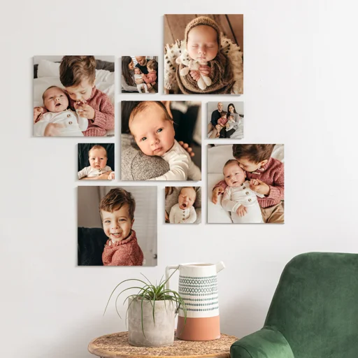 A collage of nine photos on a white wall featuring children and a baby. The photos include close-ups of different children, a baby with an adult, and a child smiling. A small table with a plant and a decorative container is in front of the collage, with a green chair nearby.