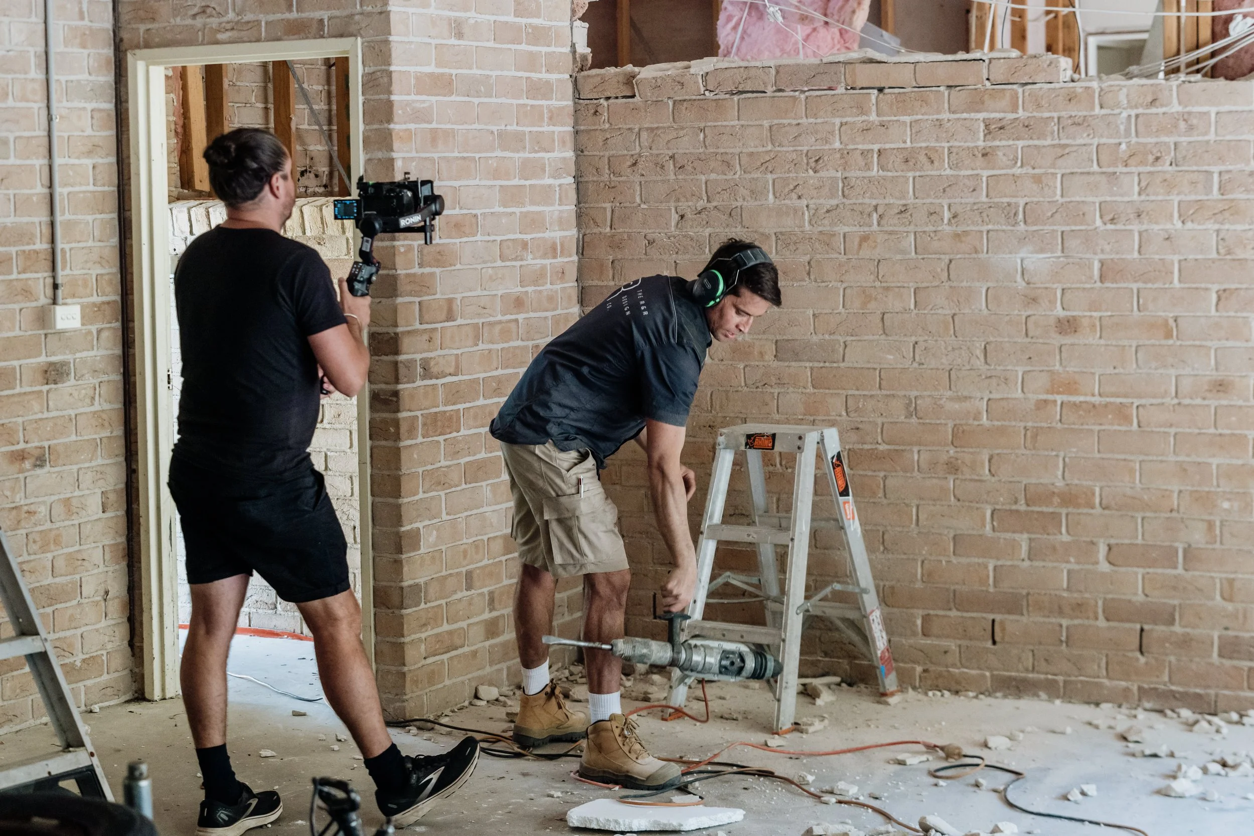Ryan on the tools and camera man filming him for their TV show Holiday Home Makeover with Rachel & Ryan, The R&R Design Co.