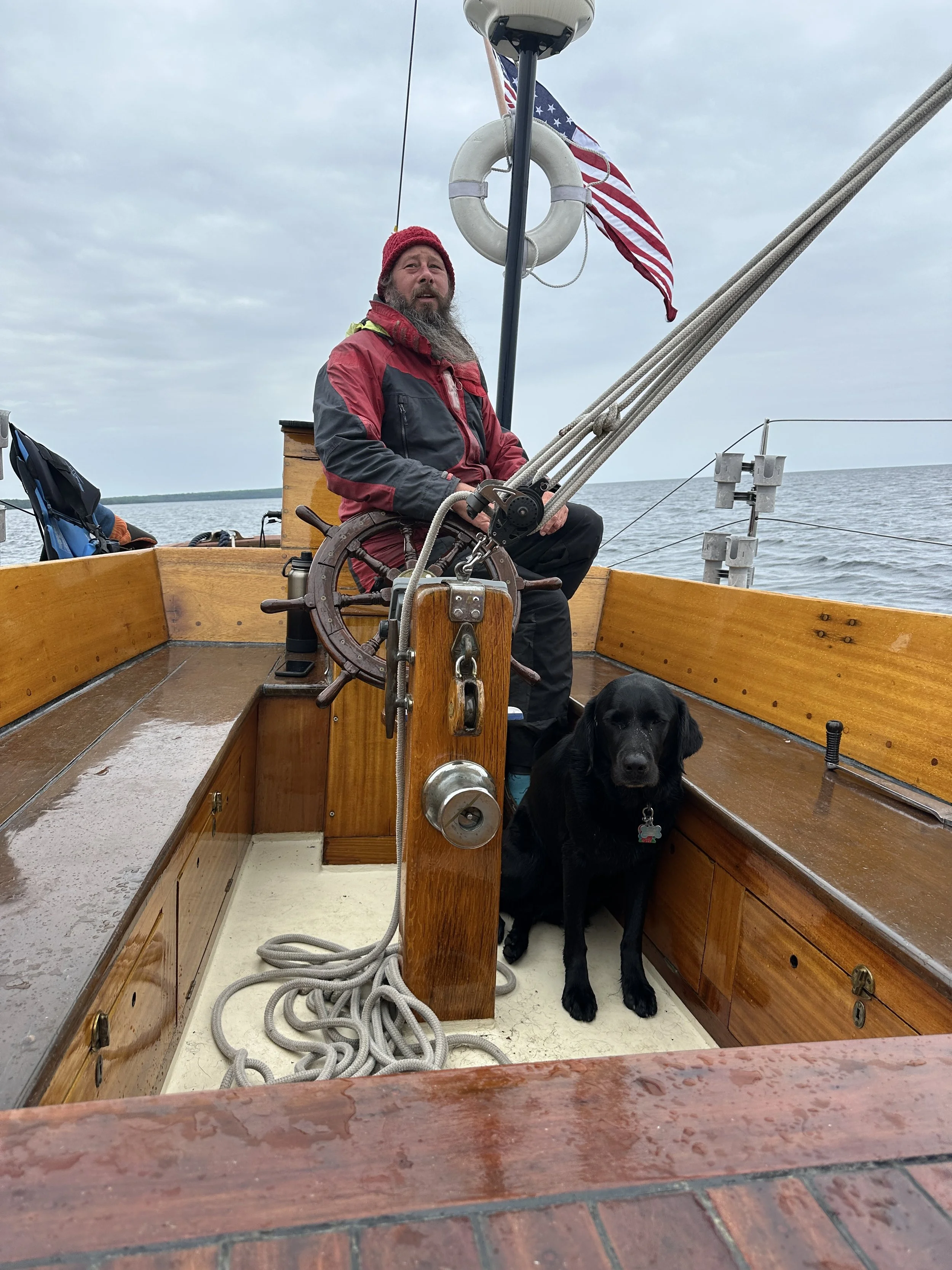 Trusty 1st puppy at Captains feet