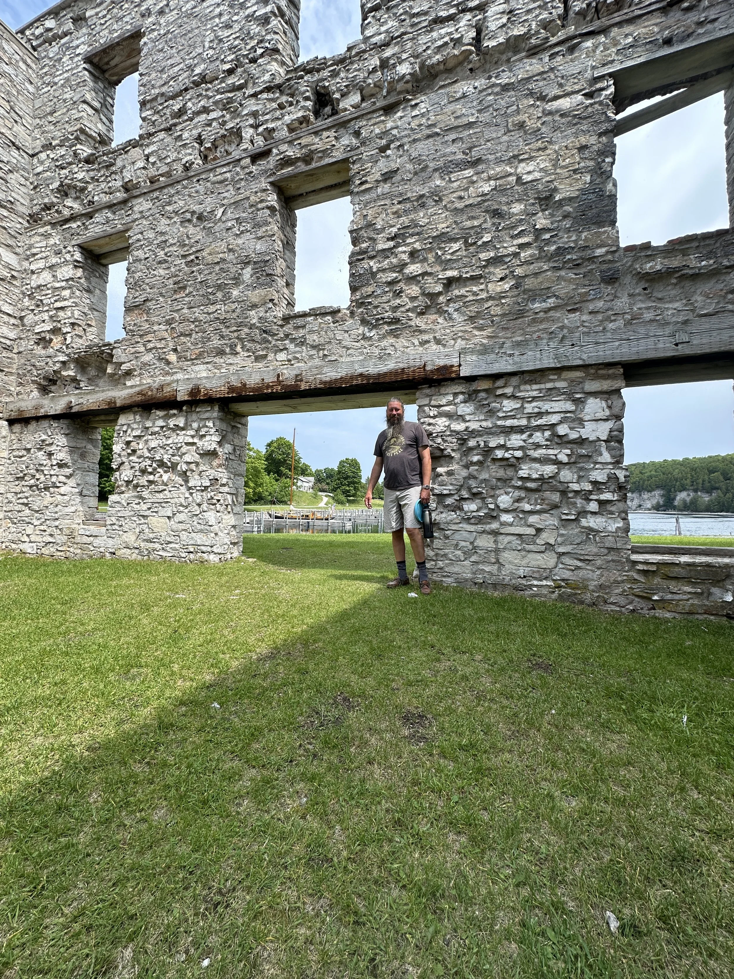 Captain standing the remains of the old company store
