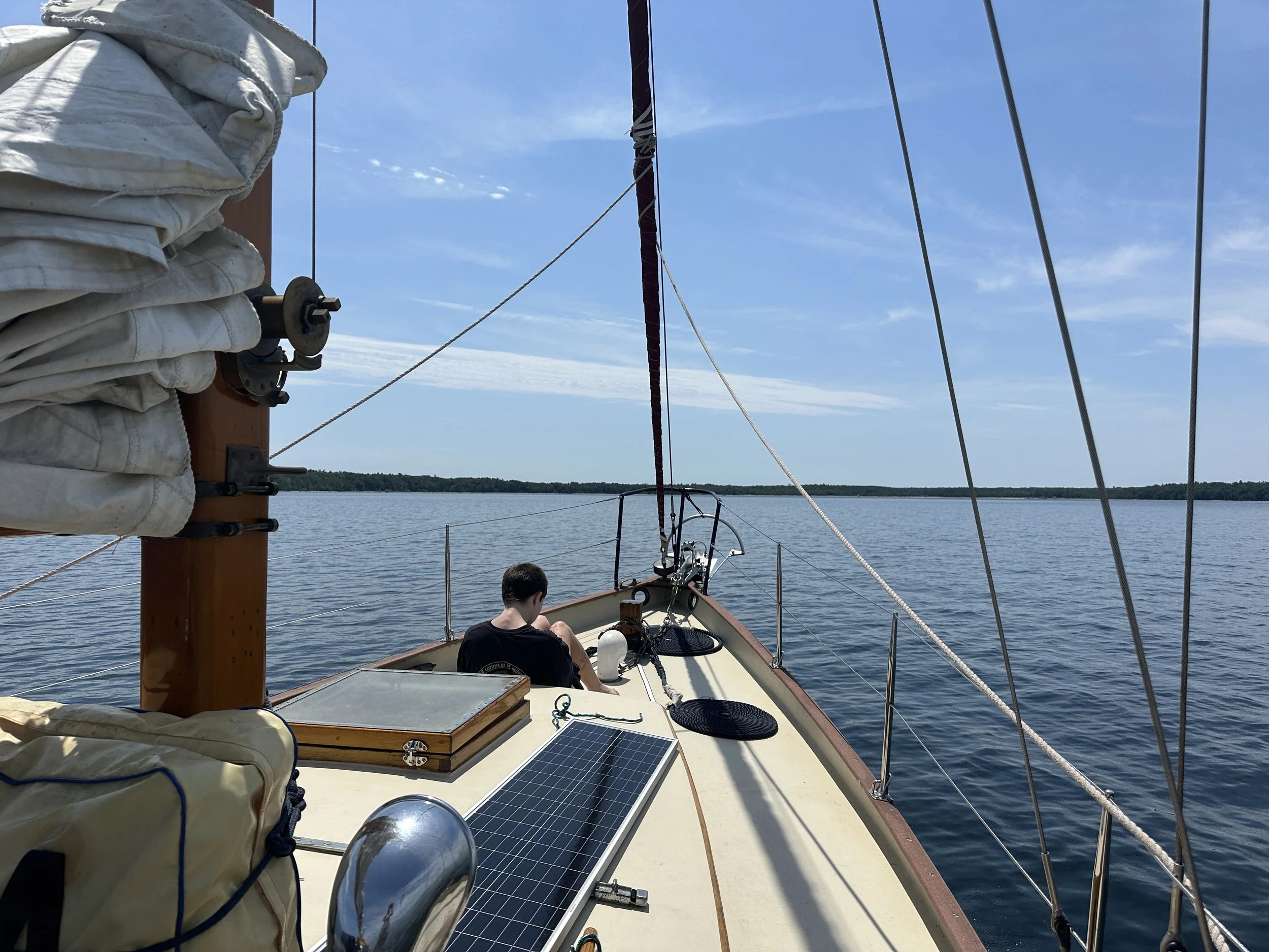 Cory enjoying updeck in the lee of Chambers Island