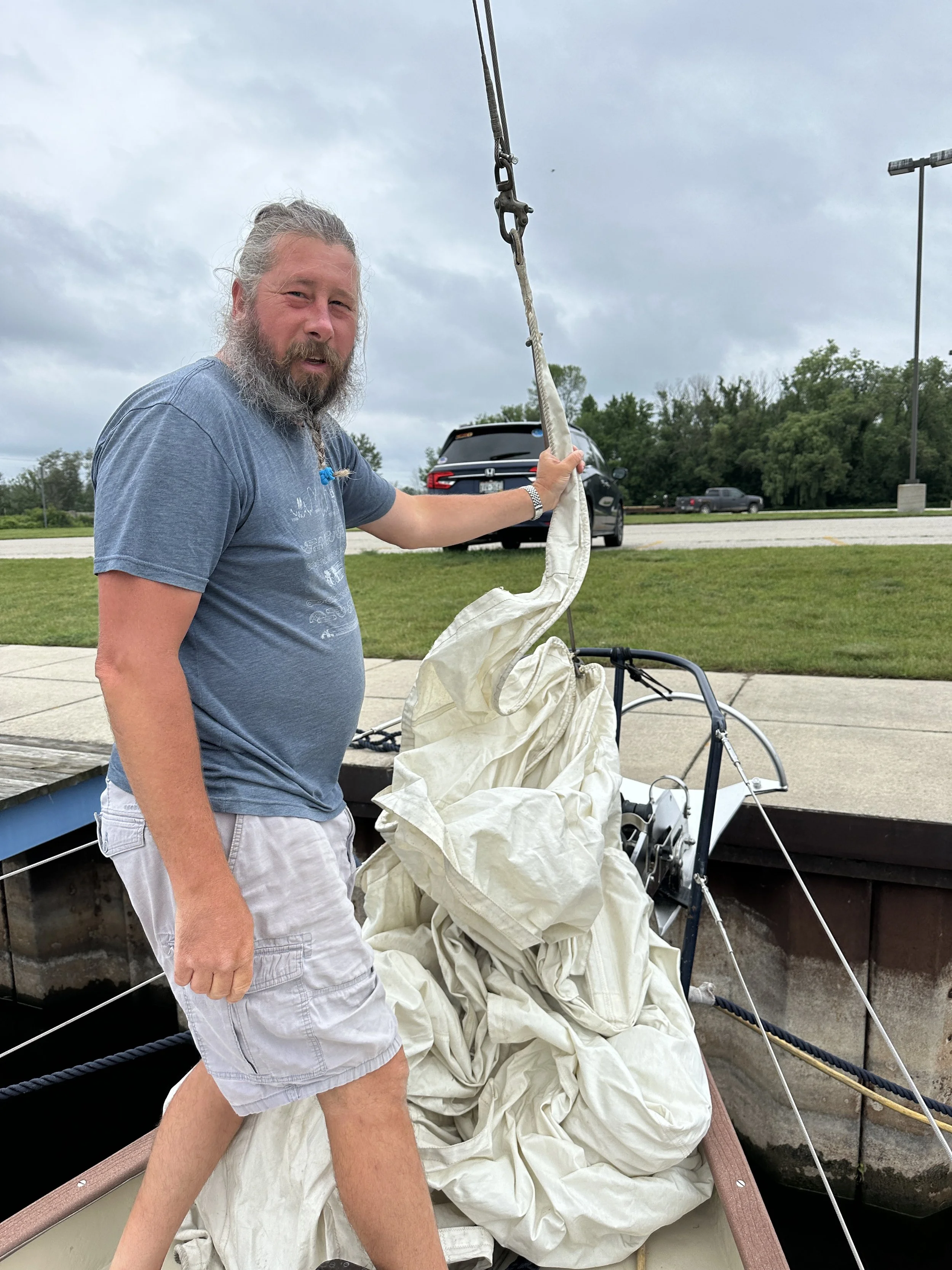 Captain putting on our smaller working jib