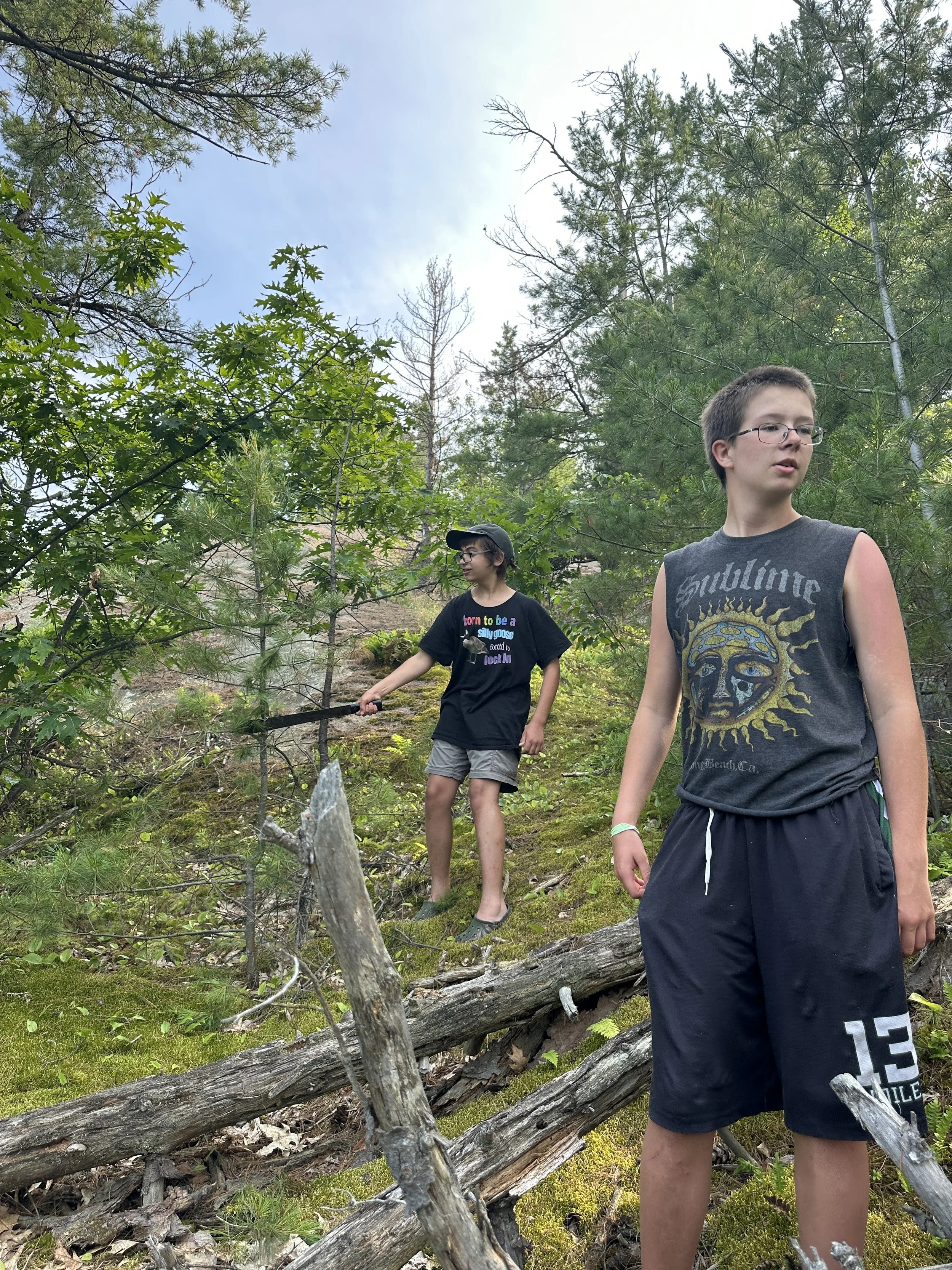 Cory waits while Bert hacks away at the trail