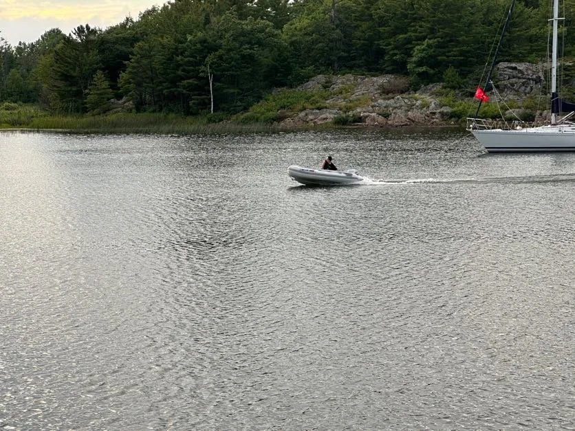 Cory getting the dinghy up on plane!!