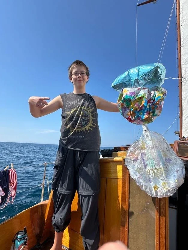 Cory posing like men with fish