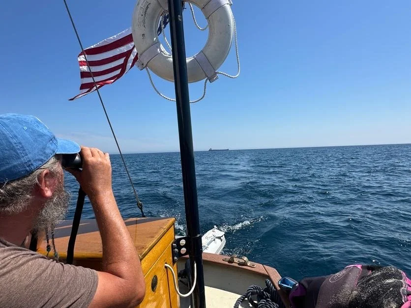 Captain watching a freighter behind us