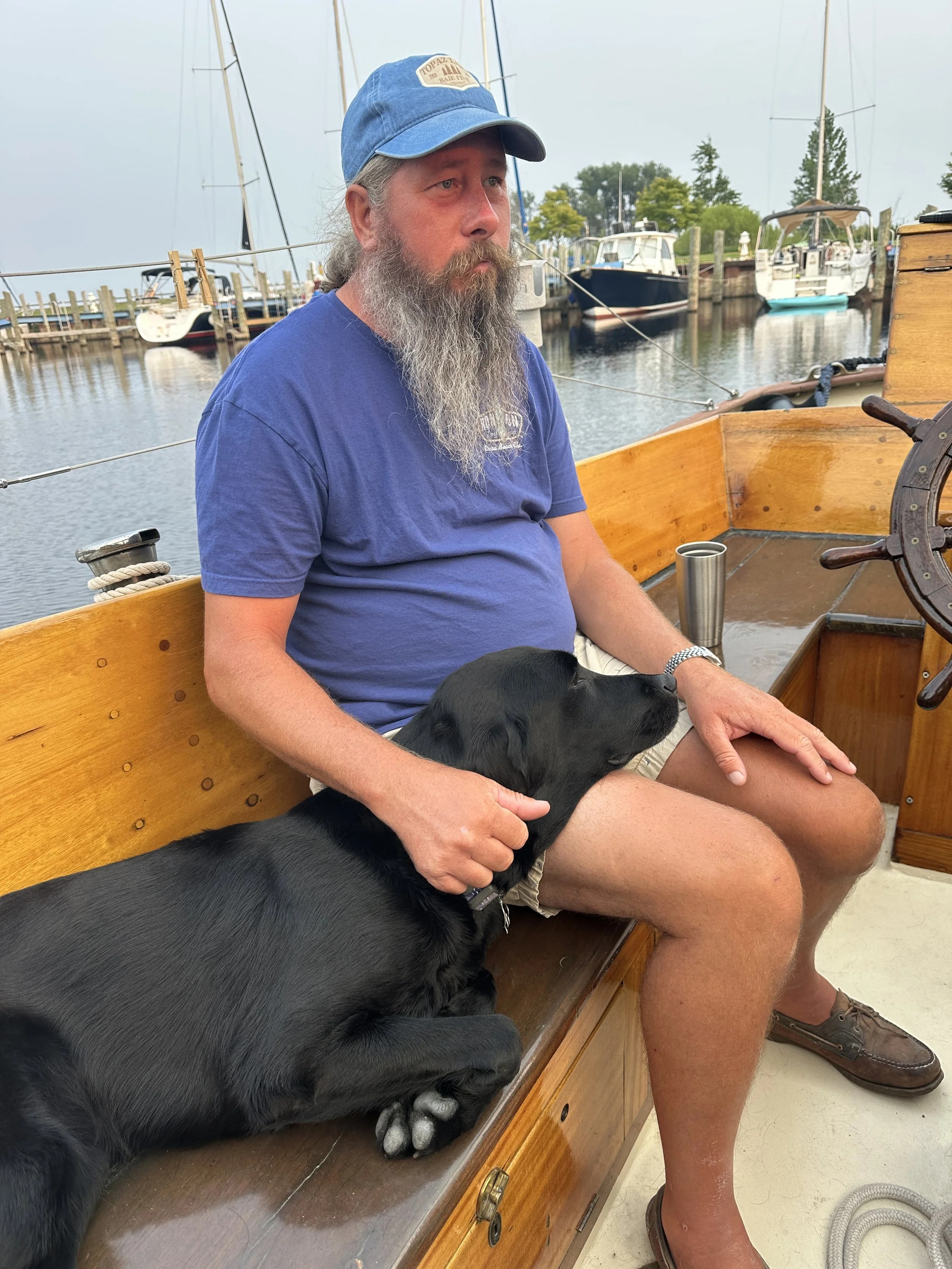 Captain and Kona chilling on deck upon our return