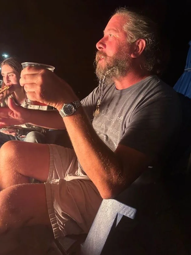 Captain telling stories by firelight