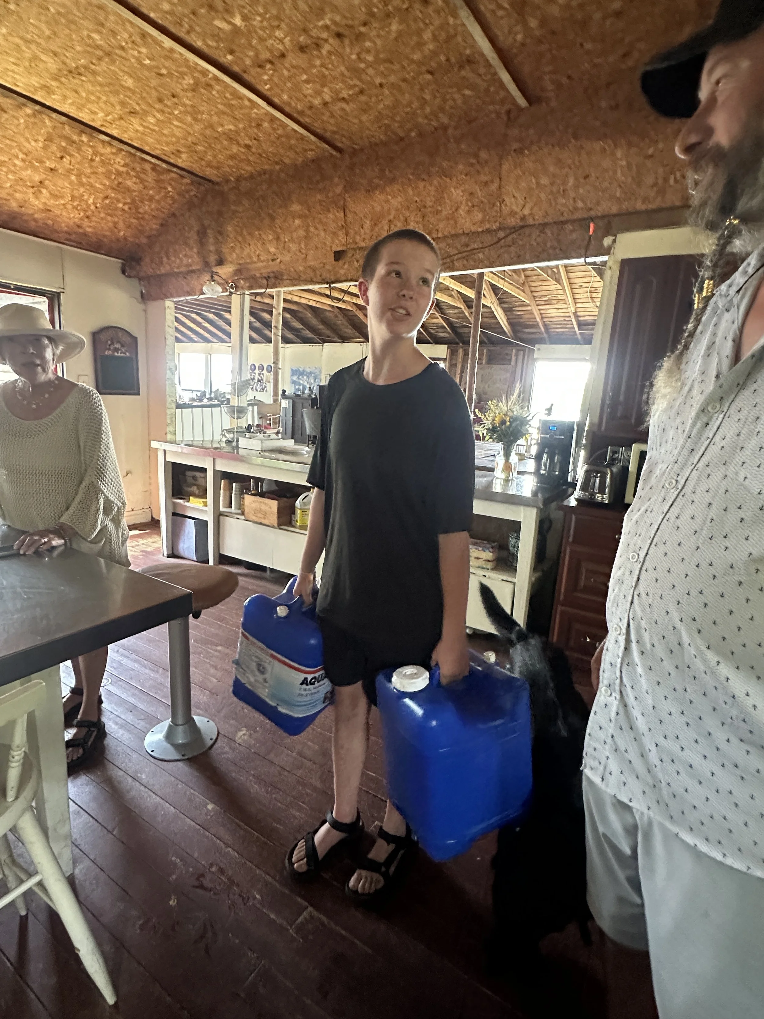 Cory carrying 14 gallons of water!