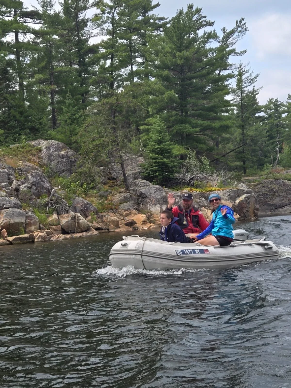Family on dinghy