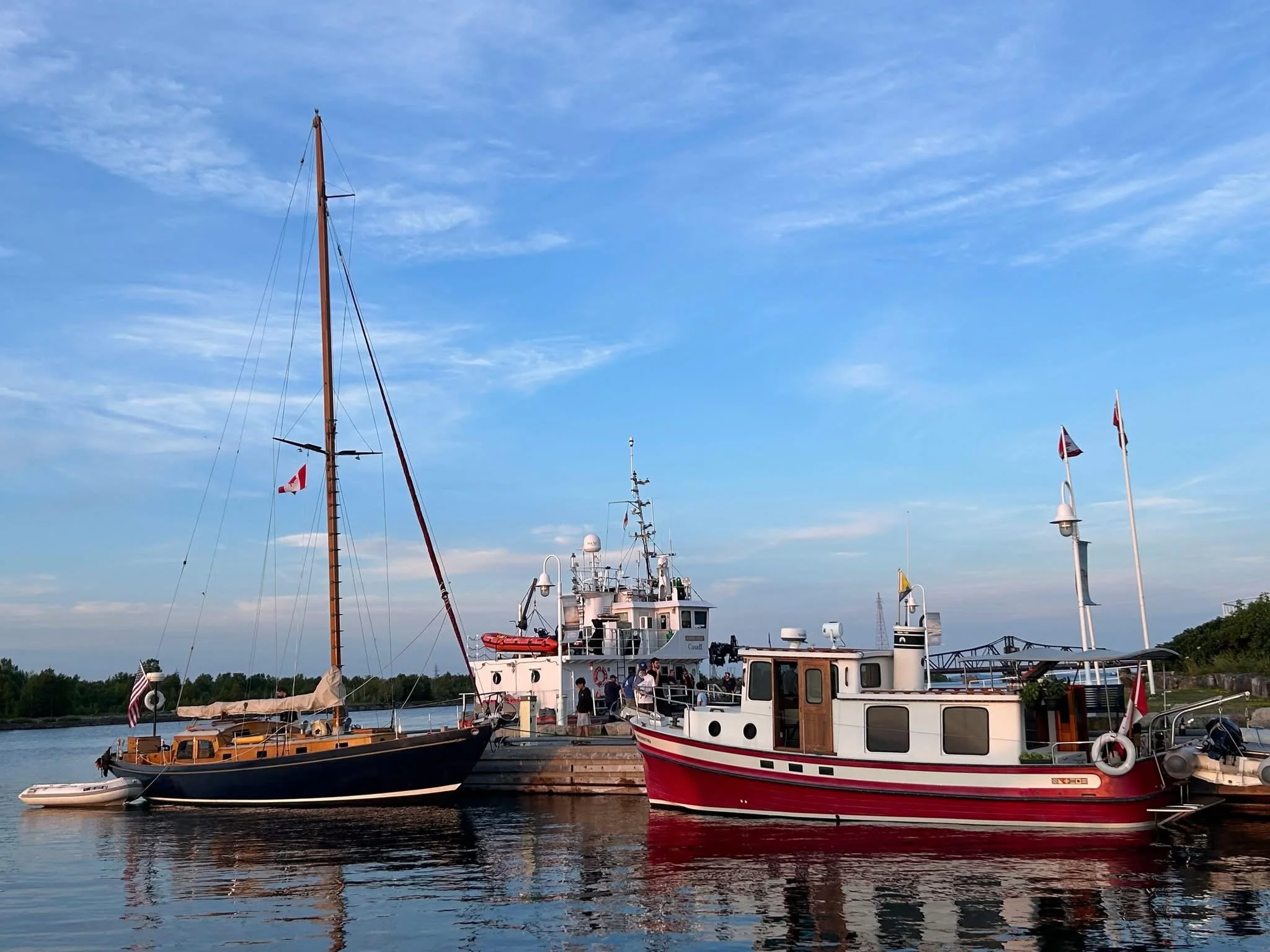 Us on the wall with a beautiful tug and Coast Guard boat