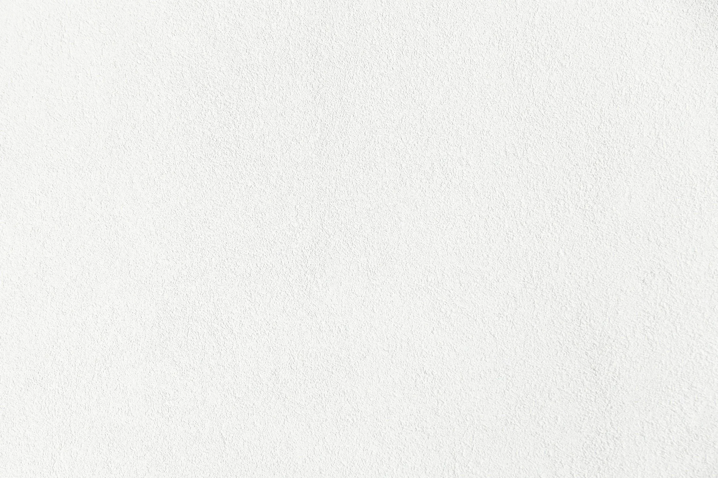 Image of a textured white wall. No objects or detailed elements are visible.