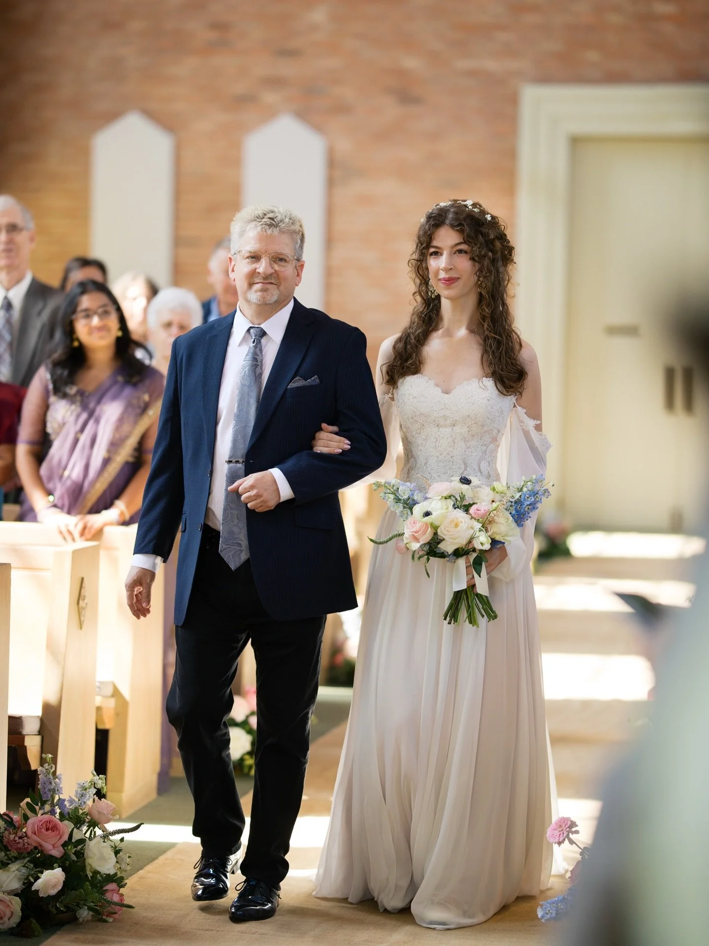 Our stylist, Sabrina, on her wedding day&mdash;

A Modecca take-home gown with an additional overlay of lace to make the neckline higher, while also making the bodice more detailed and delicate. 

The sleeves are removable with lace edging the top he