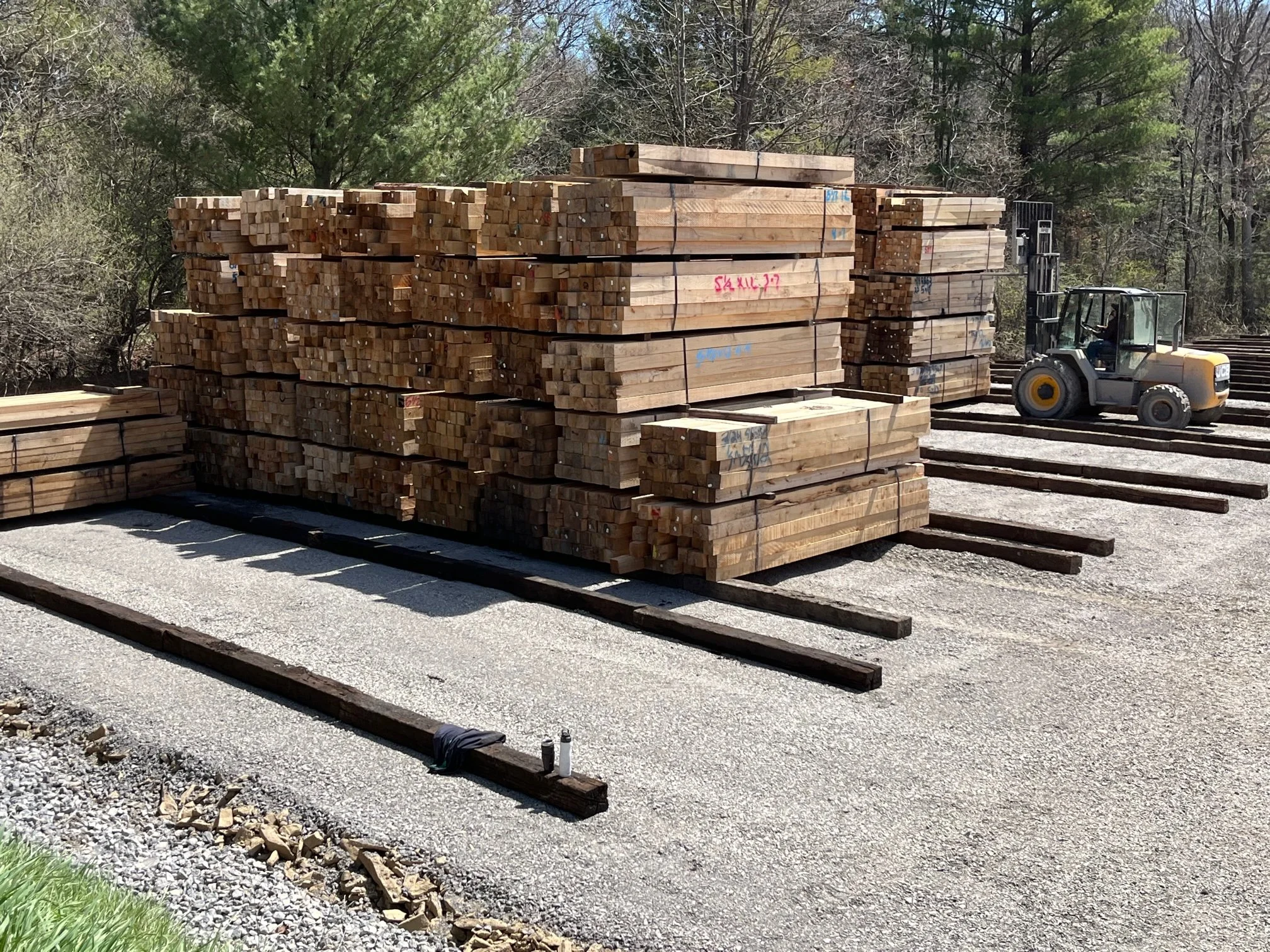 stacks of cut wood lumber for pallet manufacturing